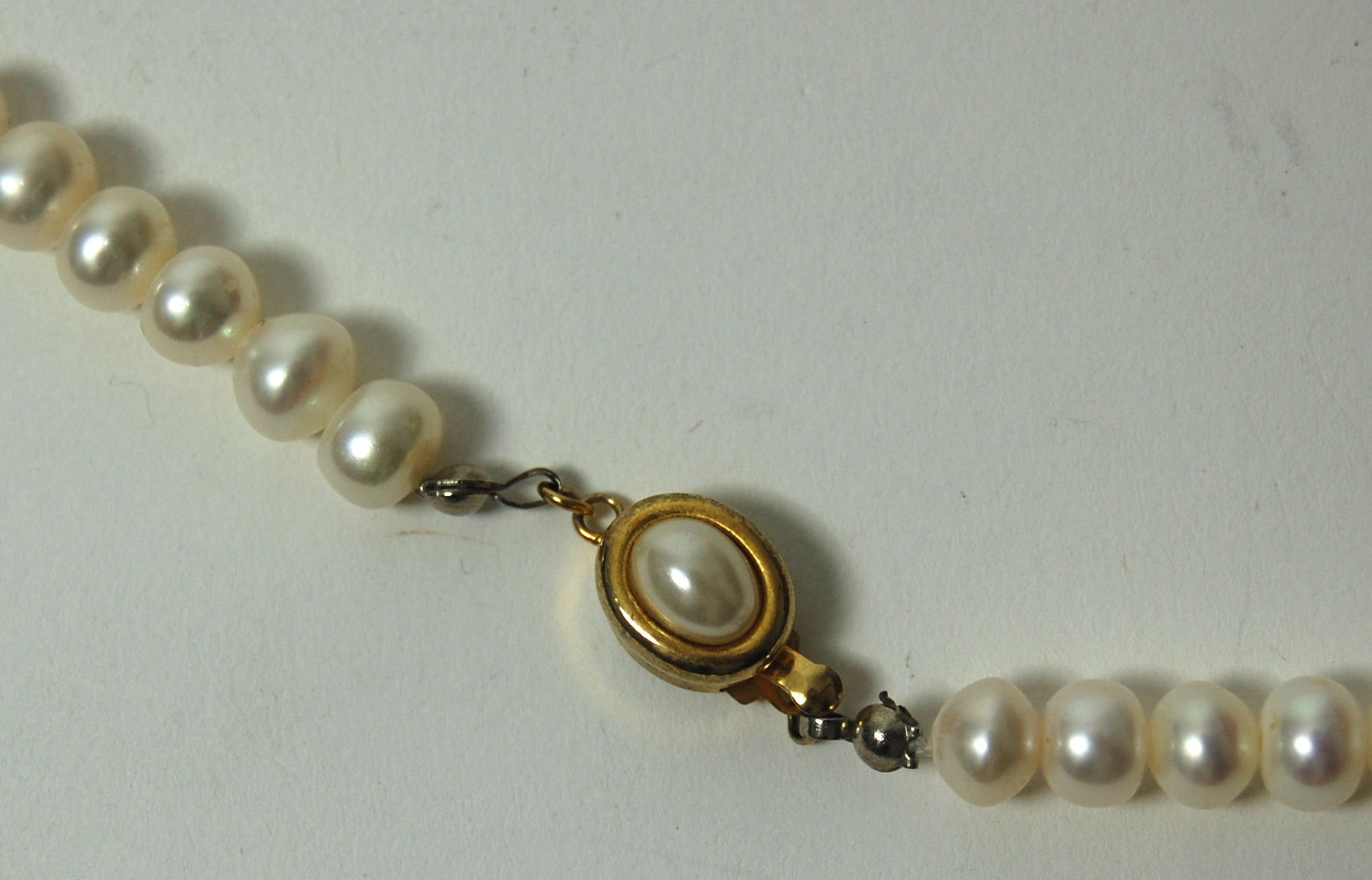 An 18ct gold mounted oval cluster ring,