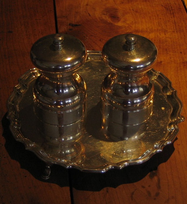 A silver capstan salt and pepper