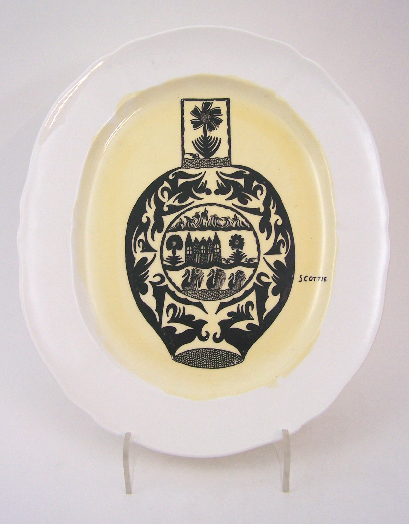 Scottie Wilson (1891-1972) An oval hand-painted ashet,