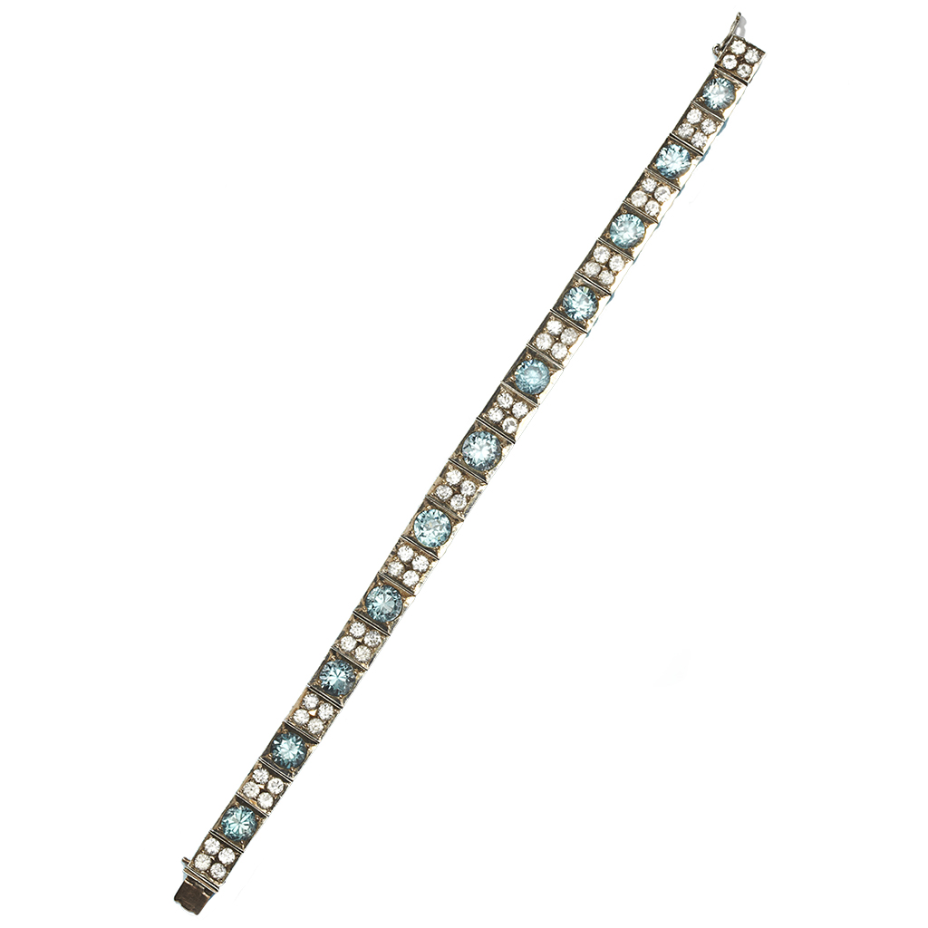 A blue and colourless zircon set bracelet