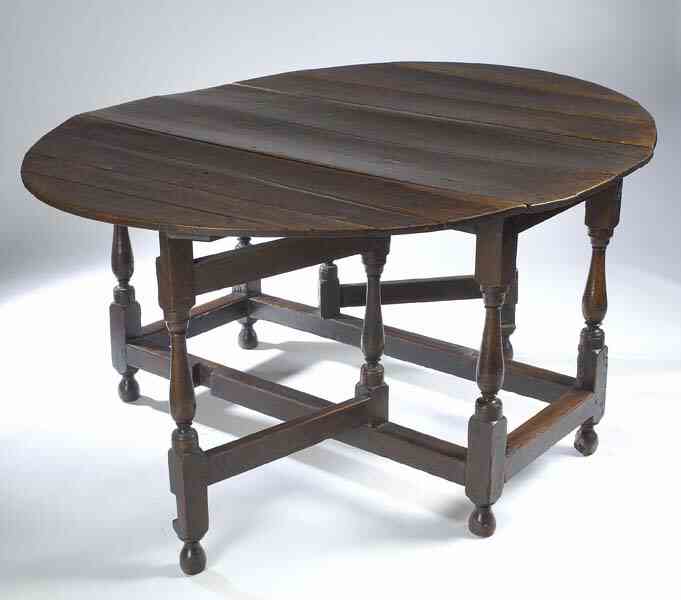 A late 17th century oak drop leaf dining table