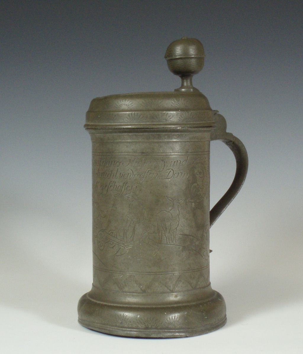 An 18th century German pewter lidded tankard
