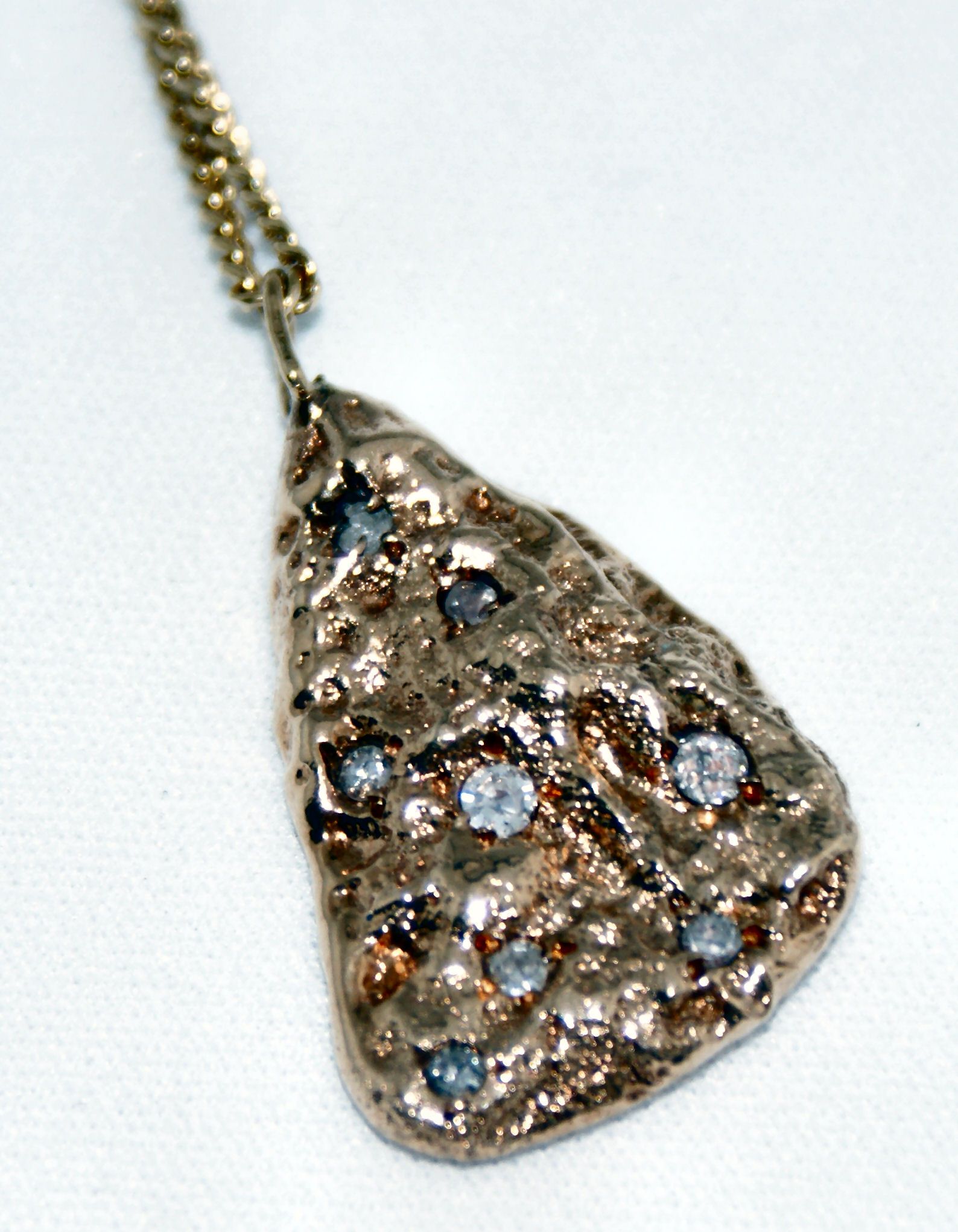 A mid-20th century diamond set pendant with chain,