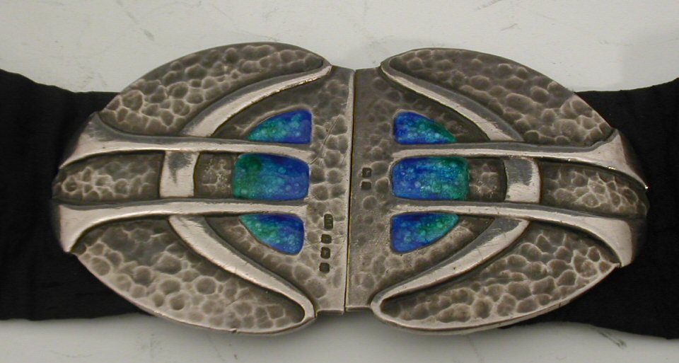 An Arts & Crafts silver and enamel belt buckle,