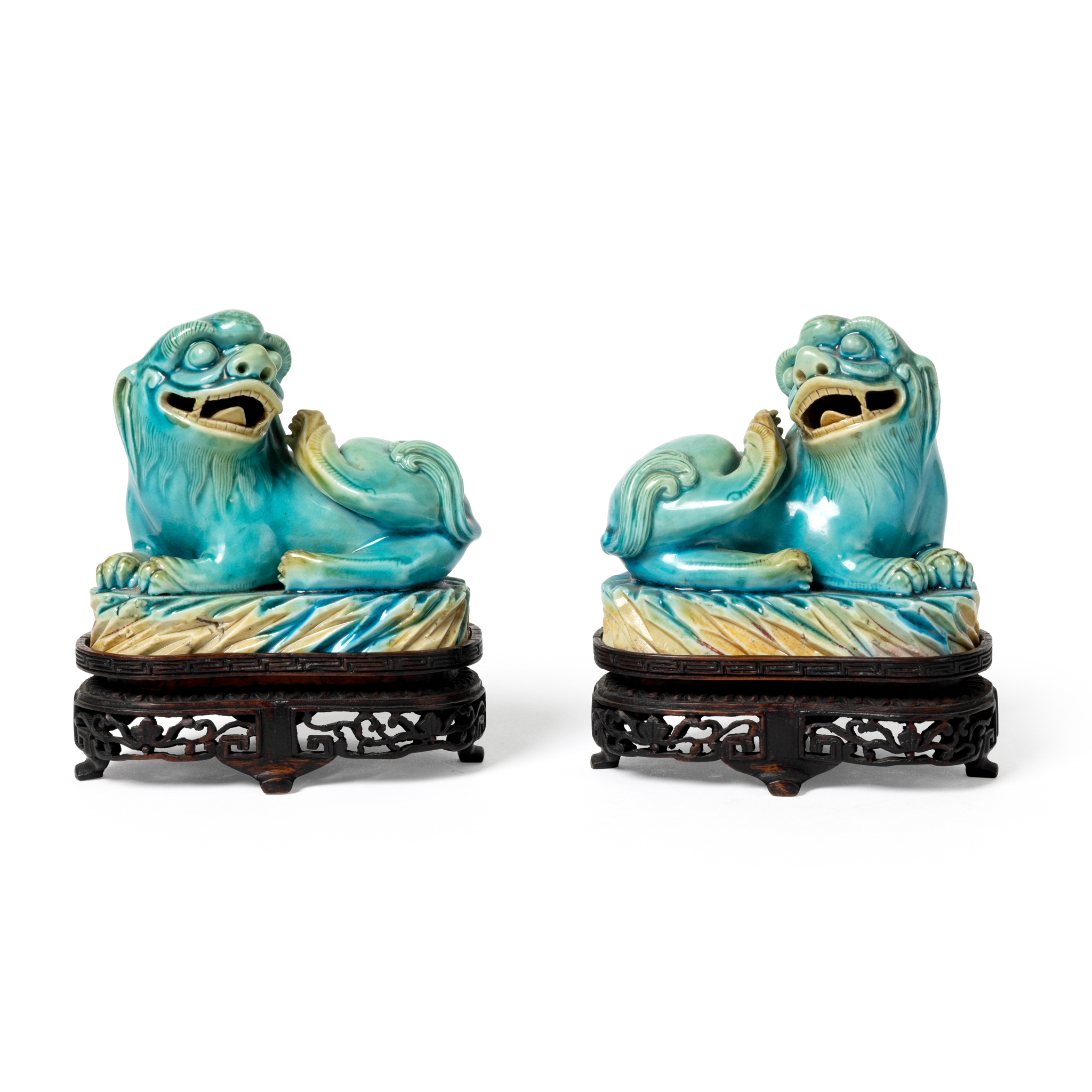 PAIR OF CHINESE TURQUOISE-GLAZED MODELS OF BUDDHIST LIONS