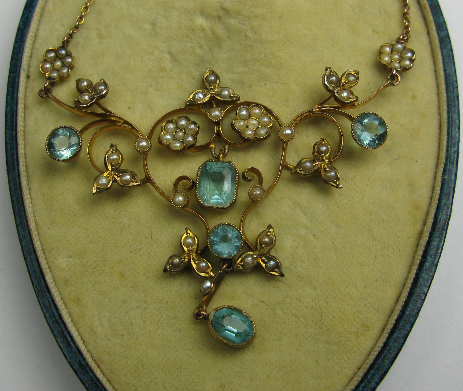 An Edwardian gold mounted aquamarine and seed pearl set necklace