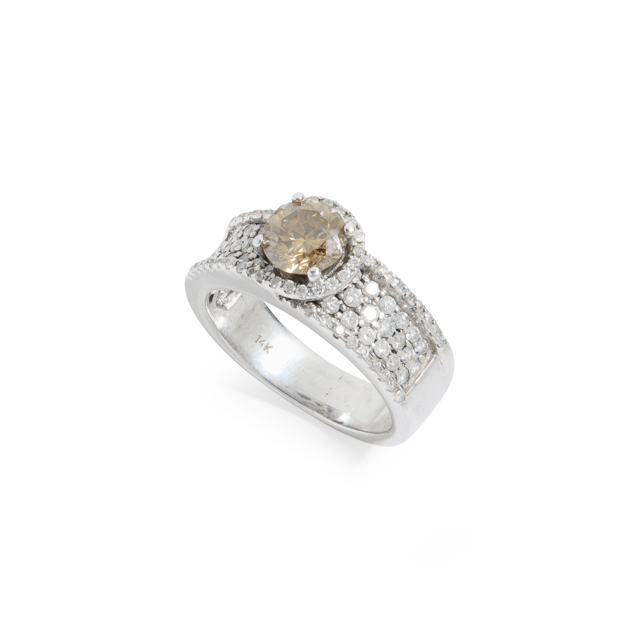 A fancy brown and colourless diamond ring