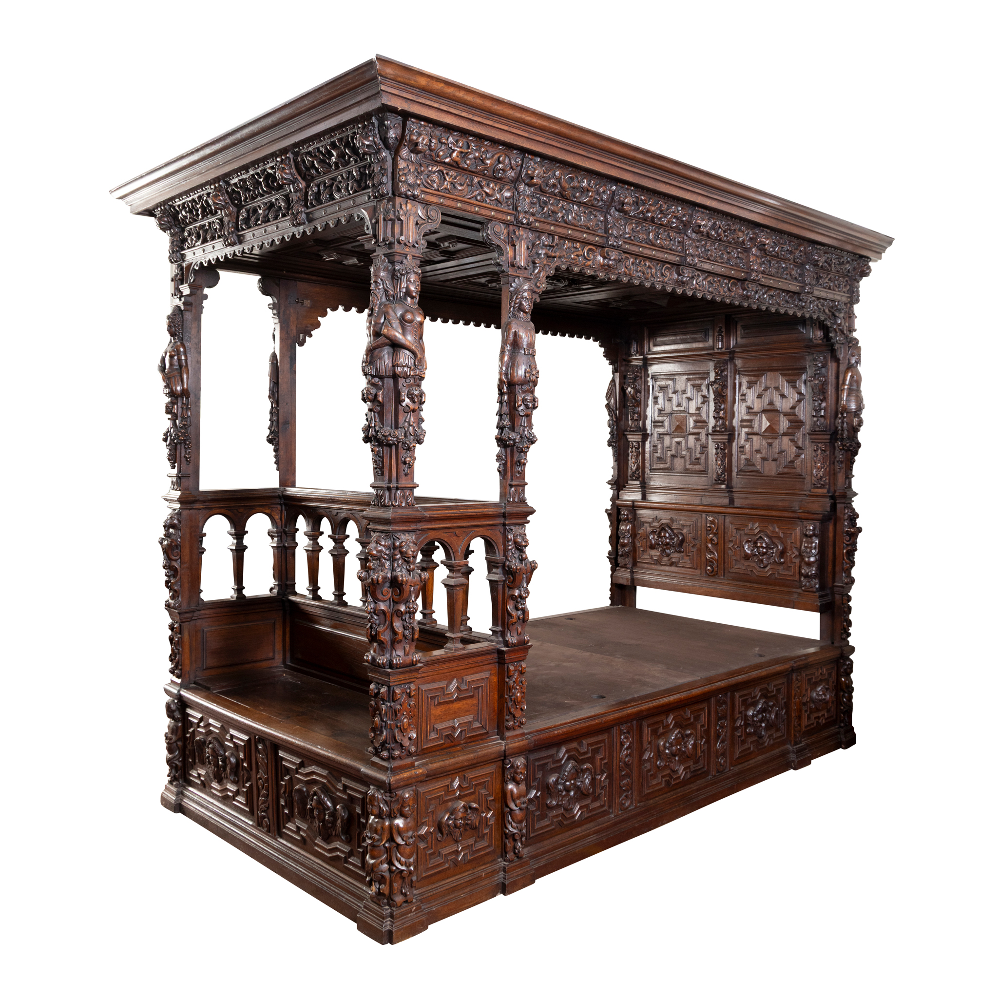 A CARVED OAK TESTER BED