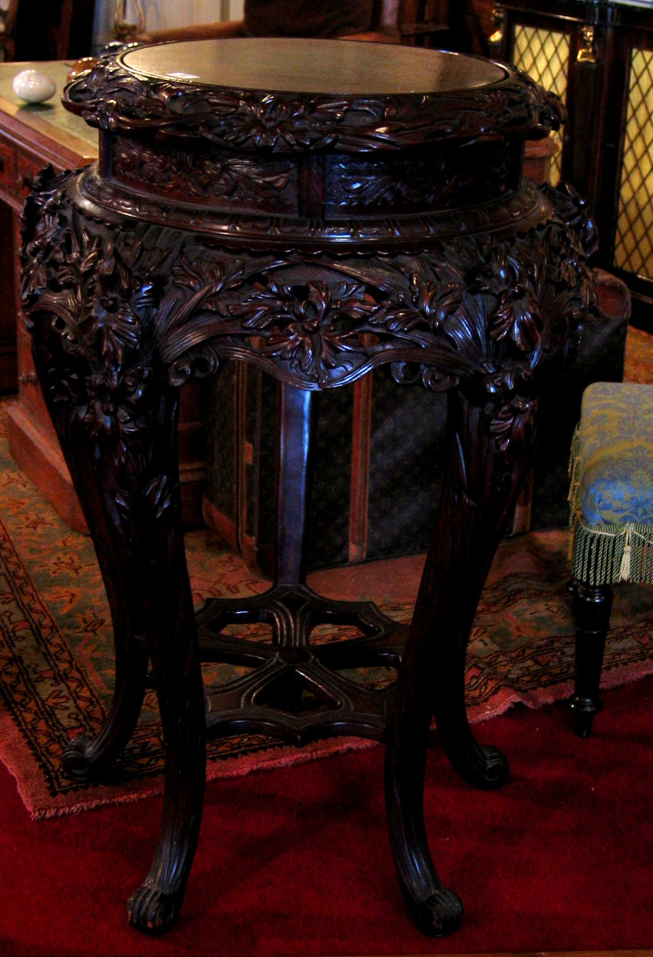 An Oriental hardwood pot stand,