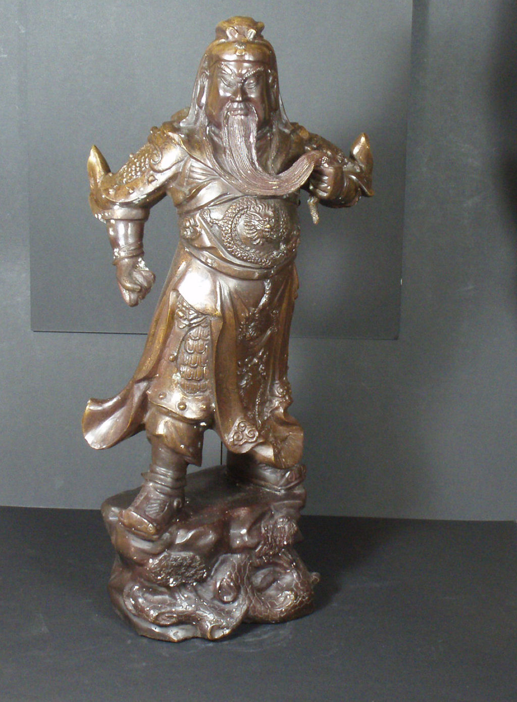 A 19th century Chinese Ming Dynasty style bronze of a standing warrior