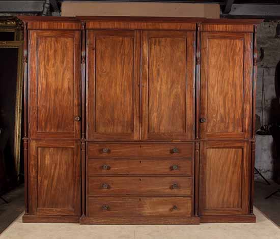 A George III mahogany breakfront linen press