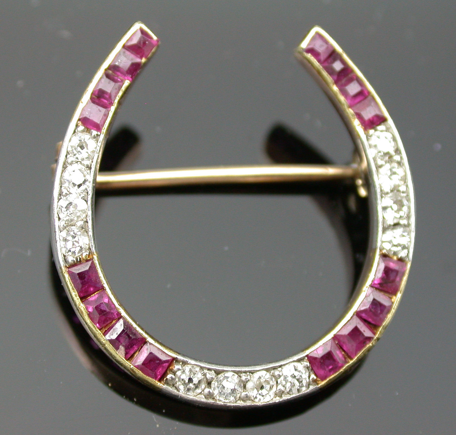 A ruby and diamond brooch,
