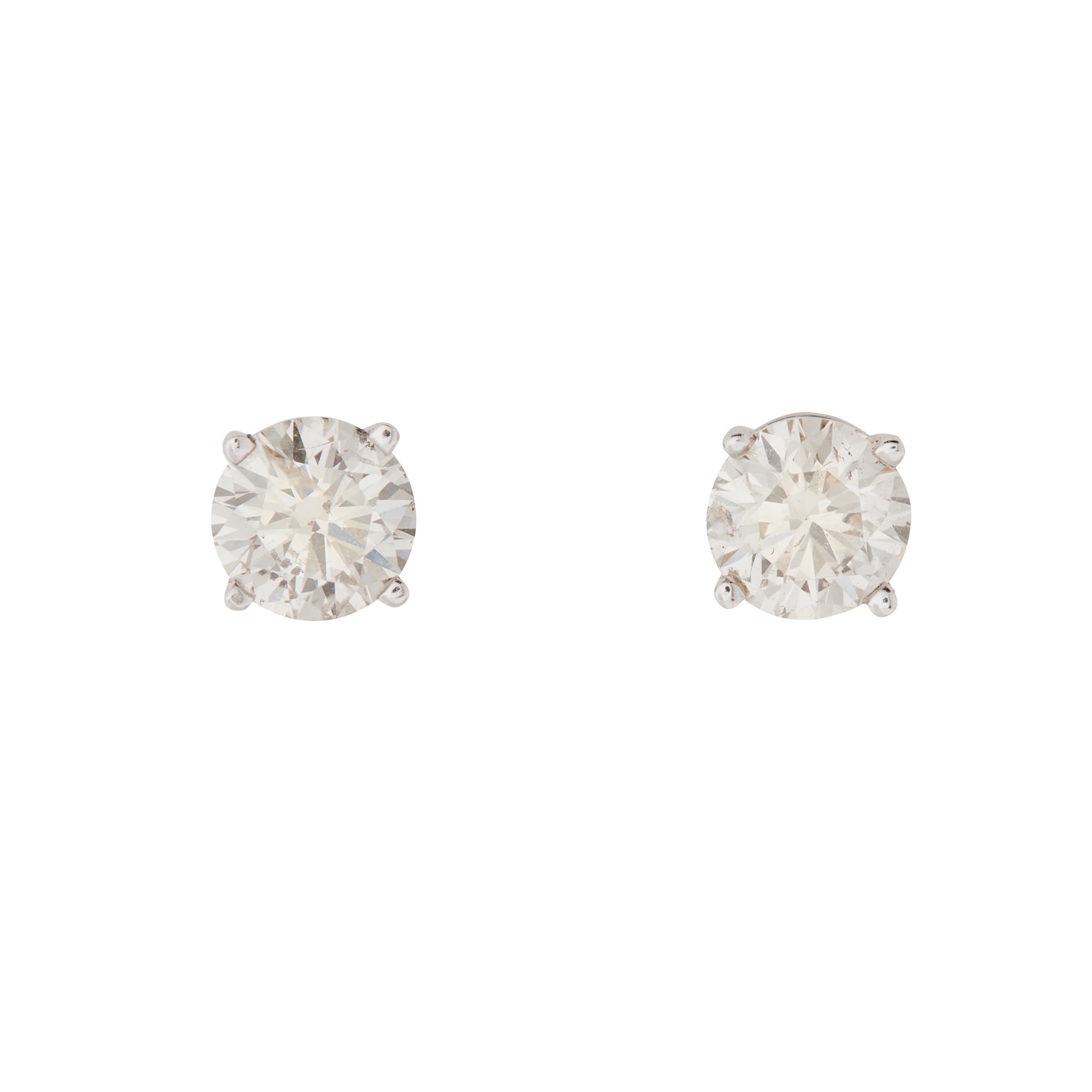 A pair of diamond stud earrings