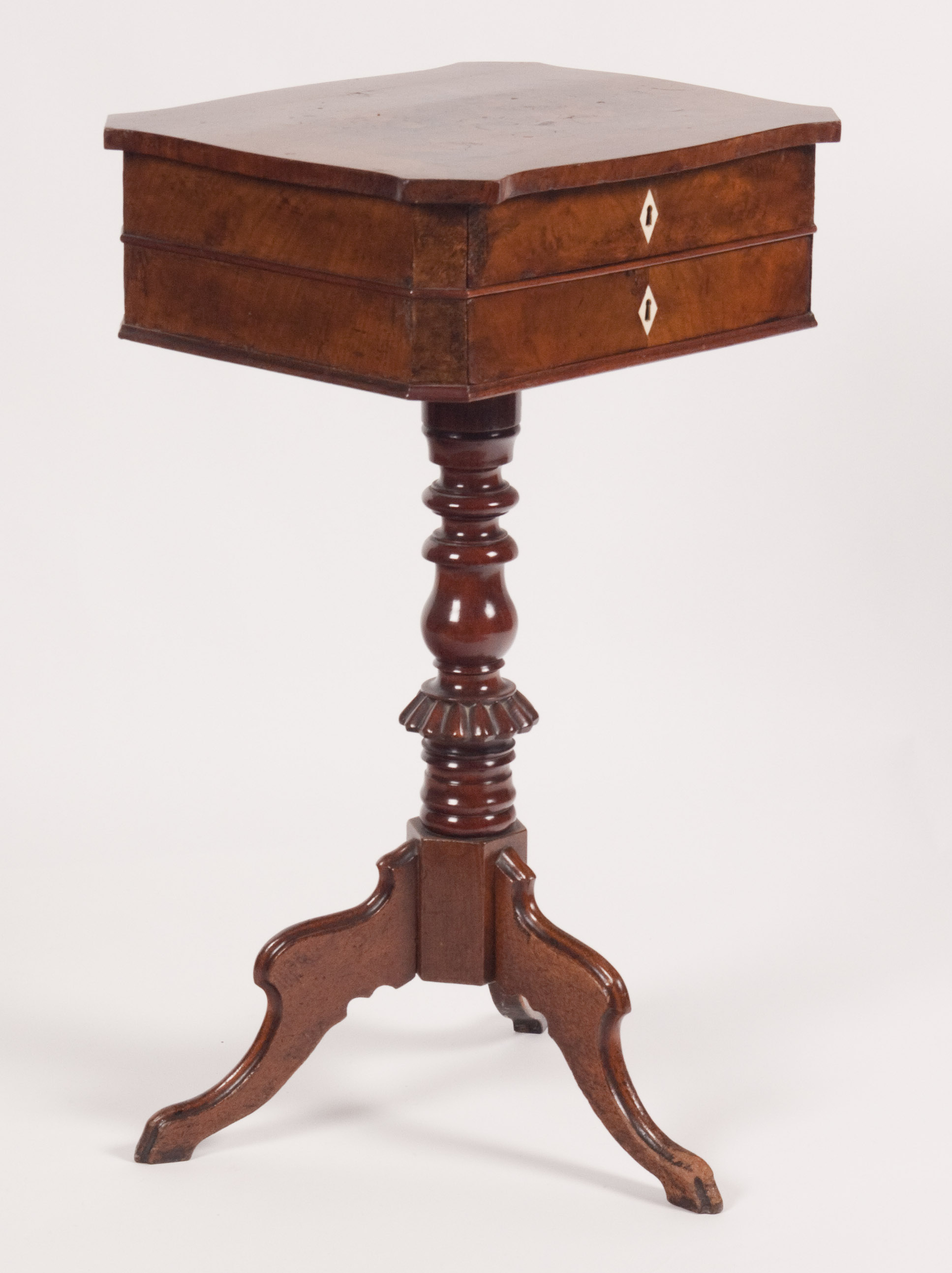 A 19th century Continental walnut work table