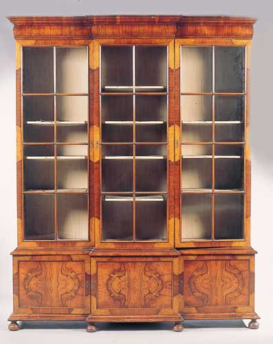 An Edwardian William and Mary style walnut breakfront bookcase