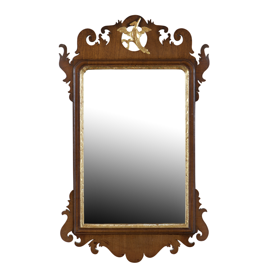 A GEORGE II MAHOGANY PARCEL GILT FRET-CARVED MIRROR