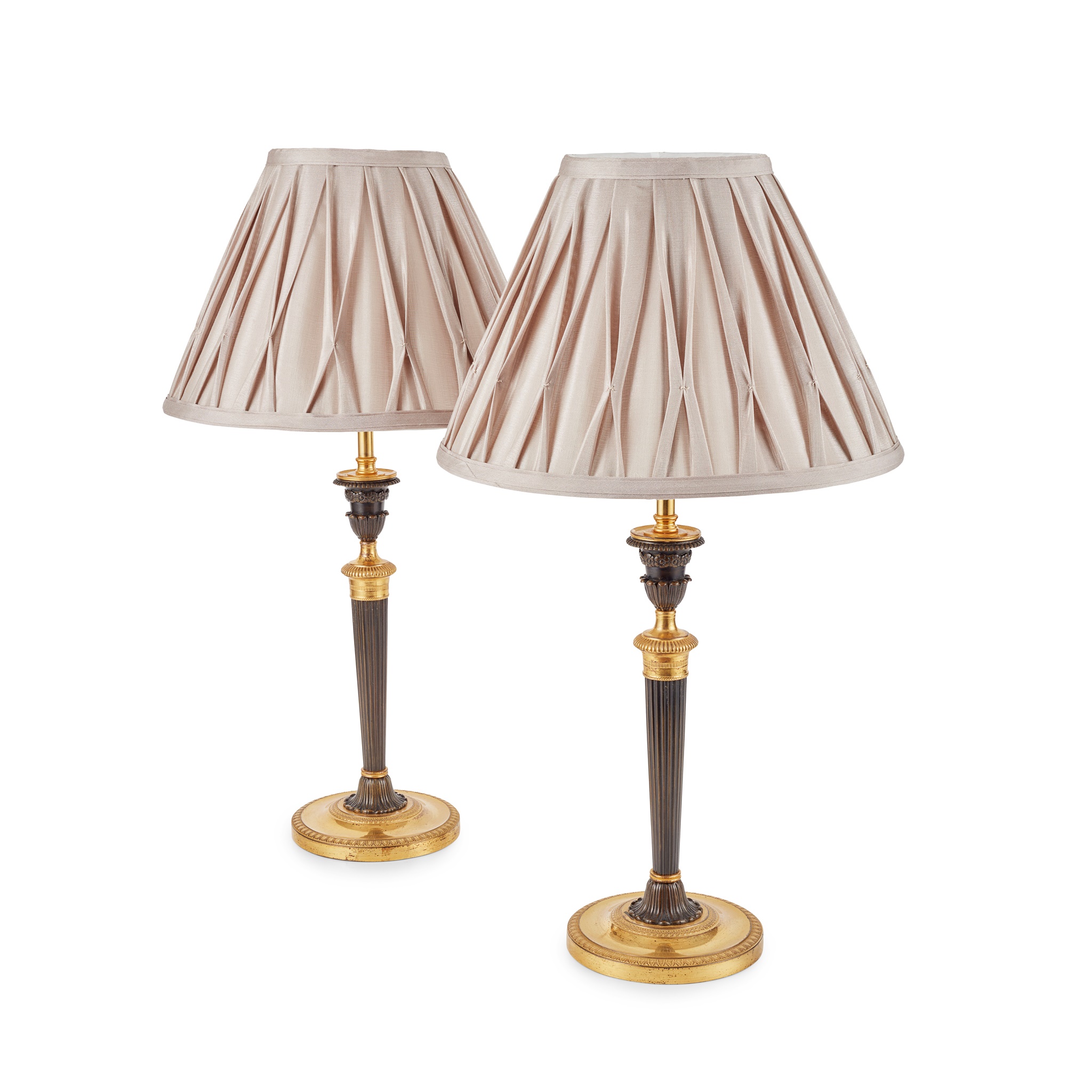 PAIR OF PATINATED BRONZE AND GILT METAL LAMPS