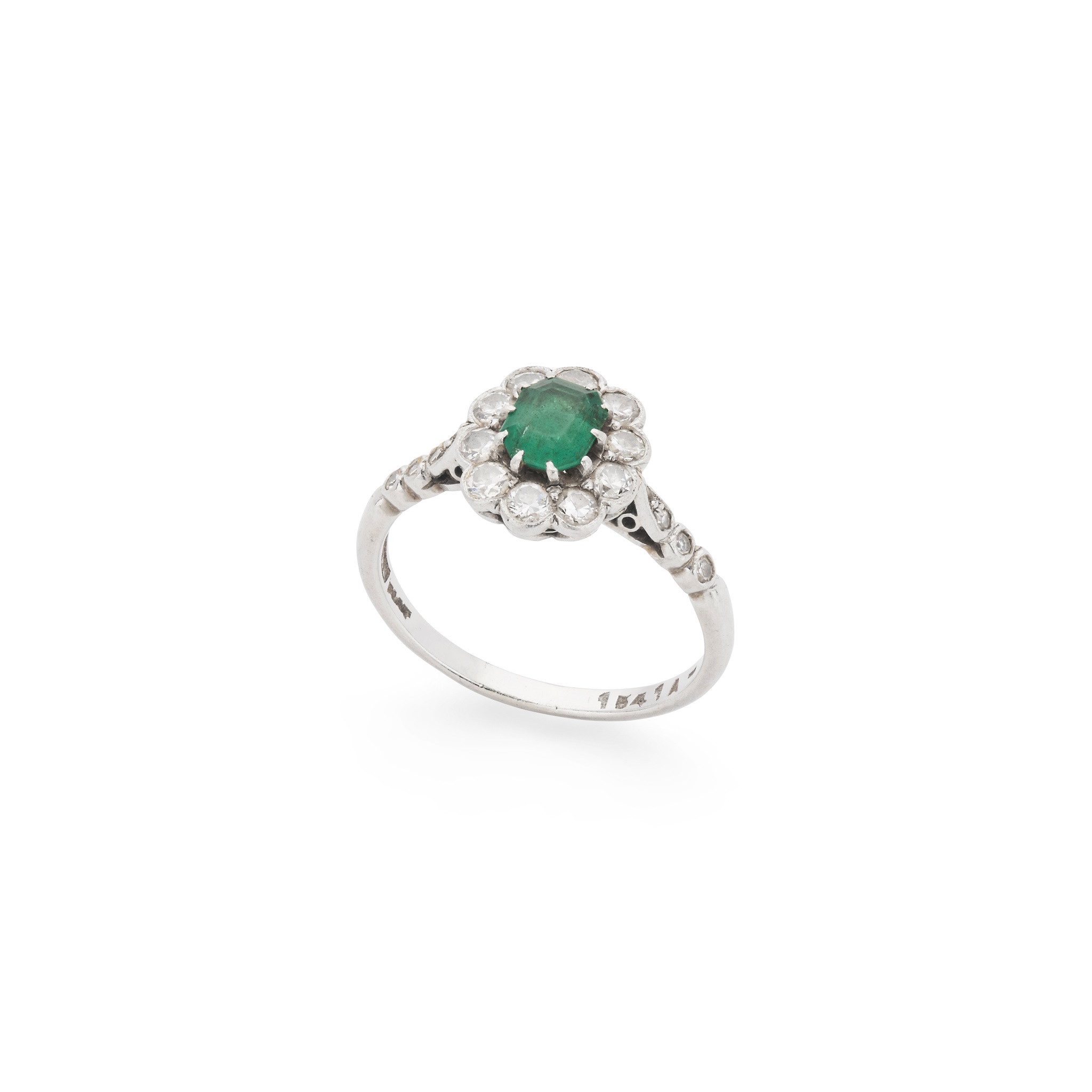 An emerald and diamond cluster ring