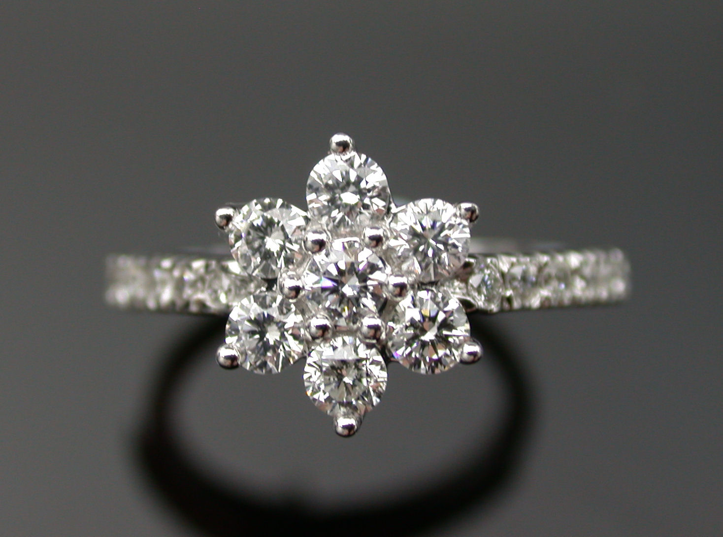 A diamond floral cluster ring,