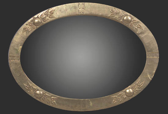 An Arts and Crafts brass framed mirror