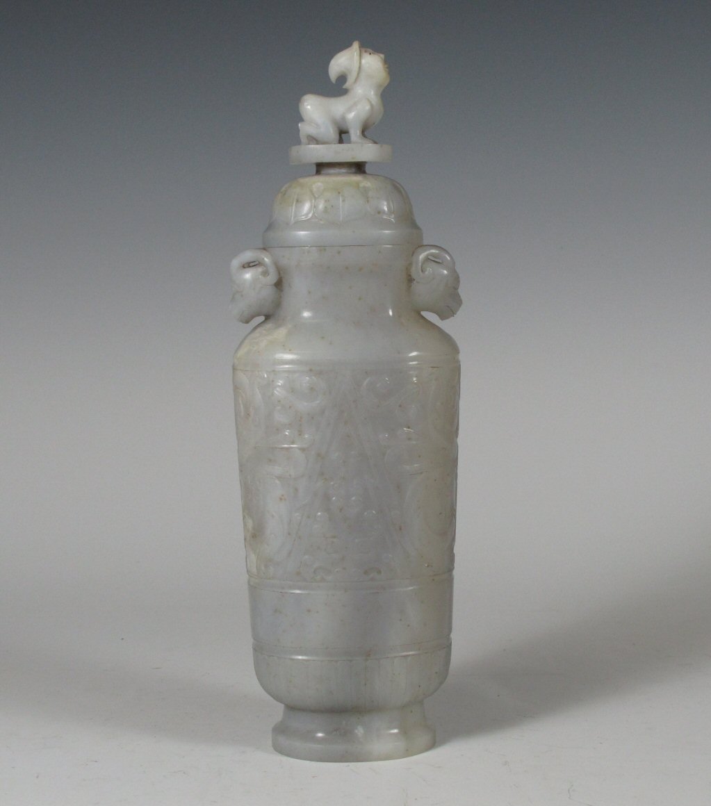 A Chinese white jade vase and cover