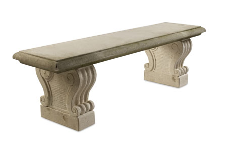 A pair of limestone garden benches