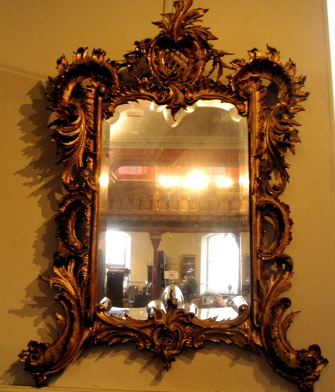 A Victorian gilt framed Rococo style mirror,