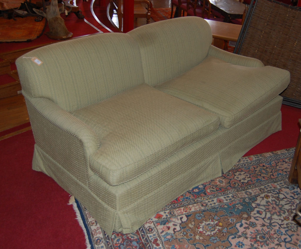 GREEN UPHOLSTERED TWO SEATER SETTEE
