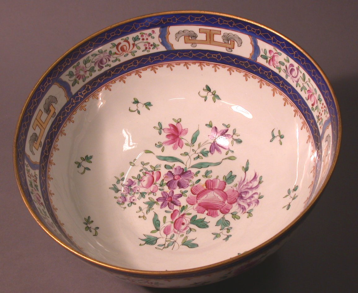A Samson famille rose armorial circular footed punch bowl,