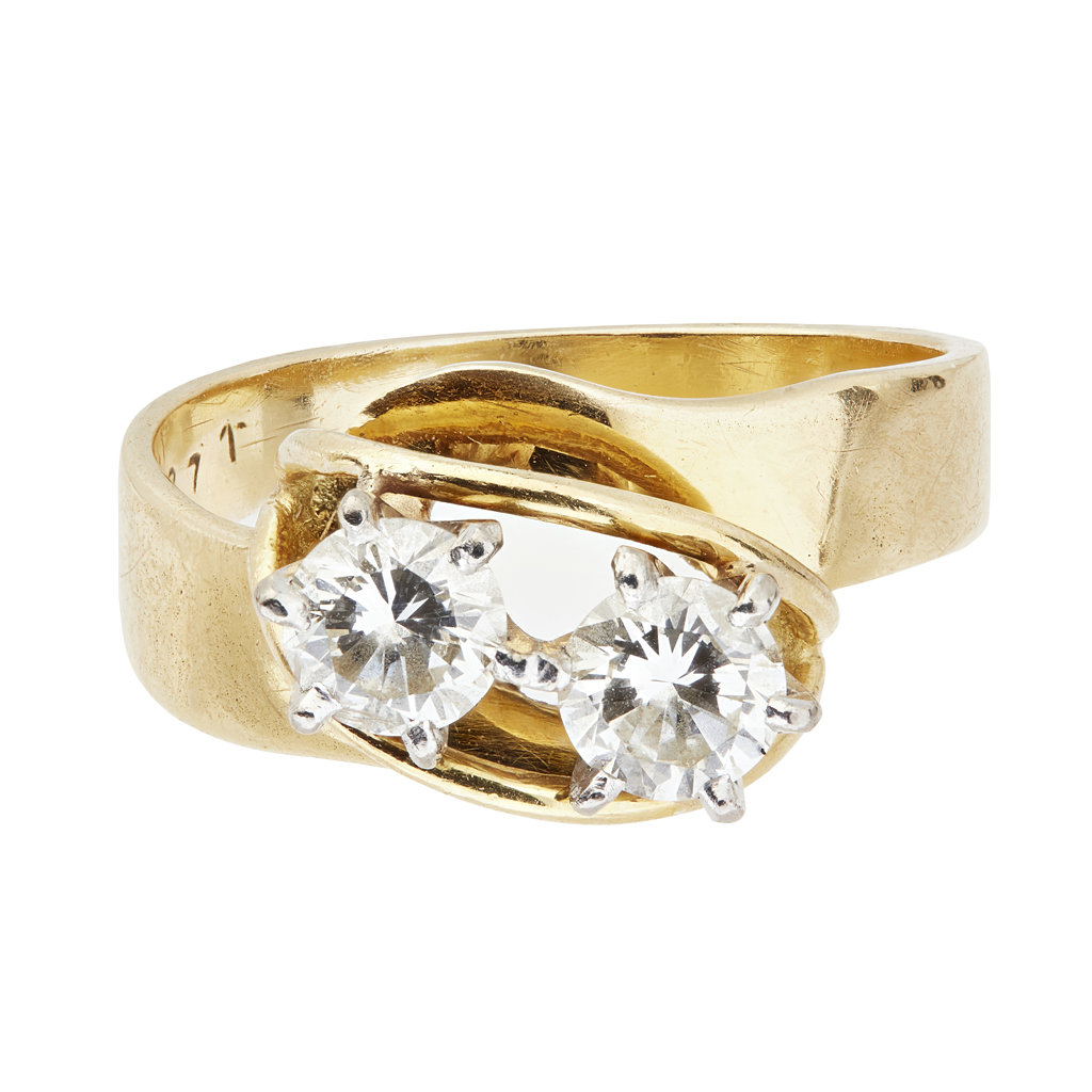 A two stone diamond set twist ring