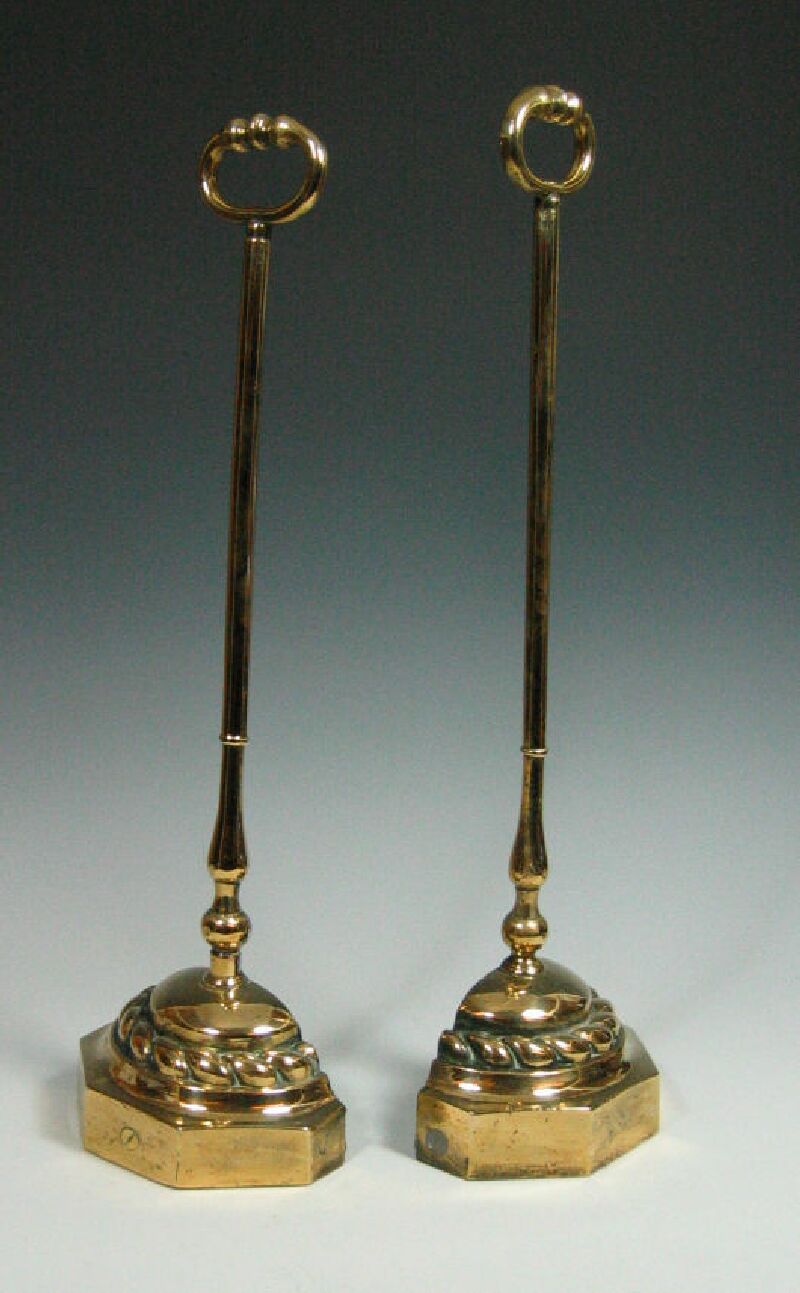 A pair of 19th century brass door stops