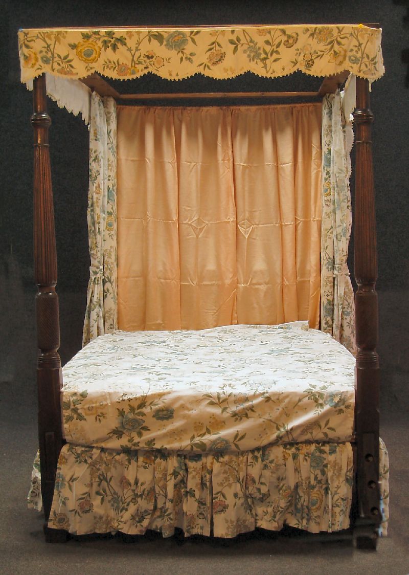 A mahogany four poster bed