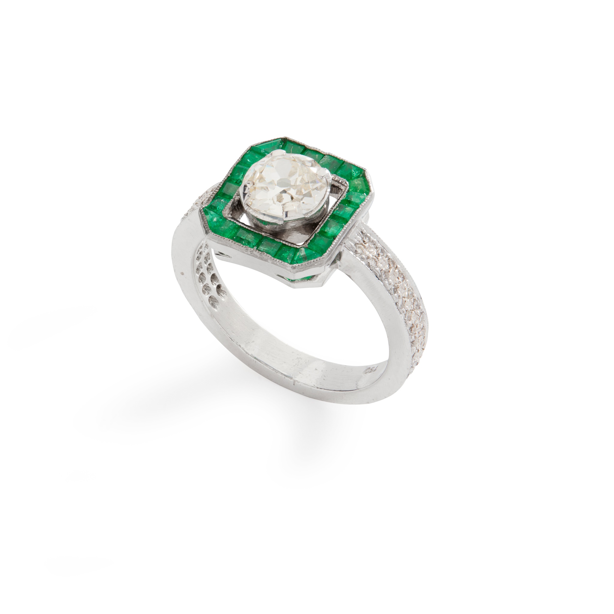 A diamond and emerald ring