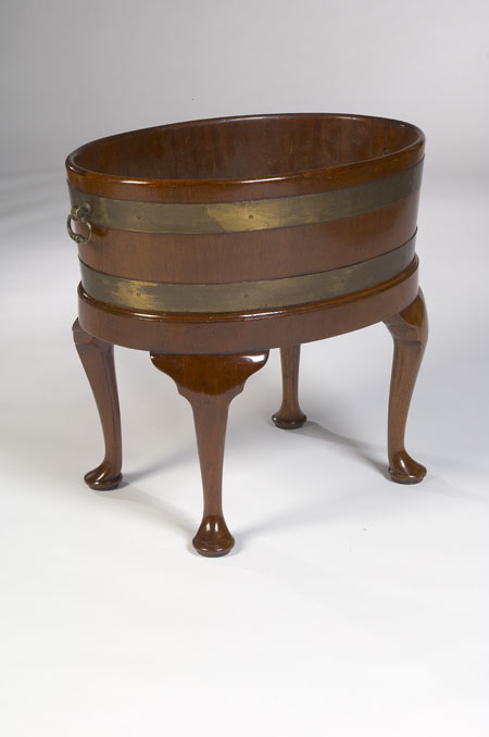 A staved mahogany and brass bound oval jardiniere