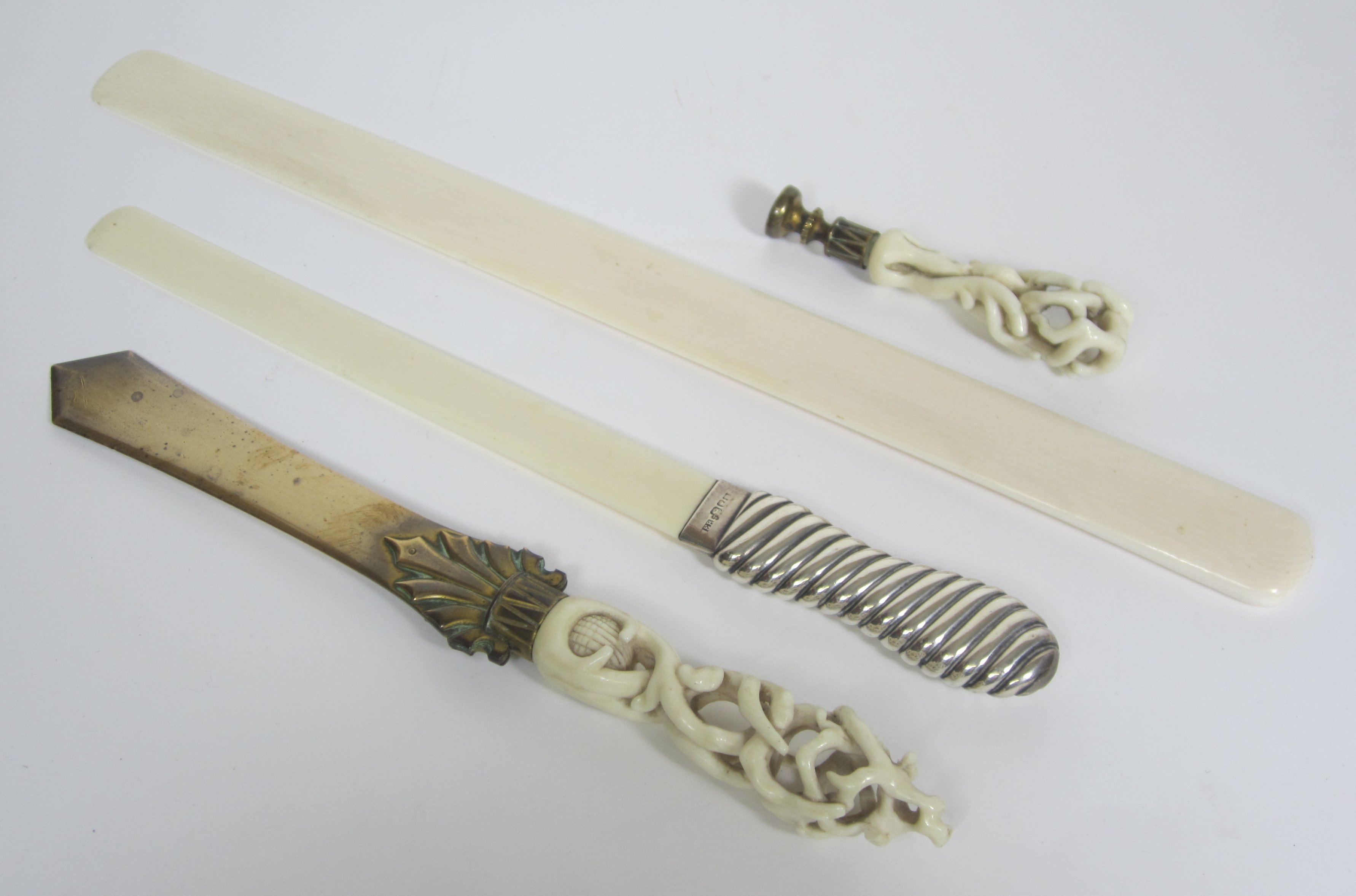 GROUP OF THREE IVORY MOUNTED LETTER OPENERS AND A SEAL