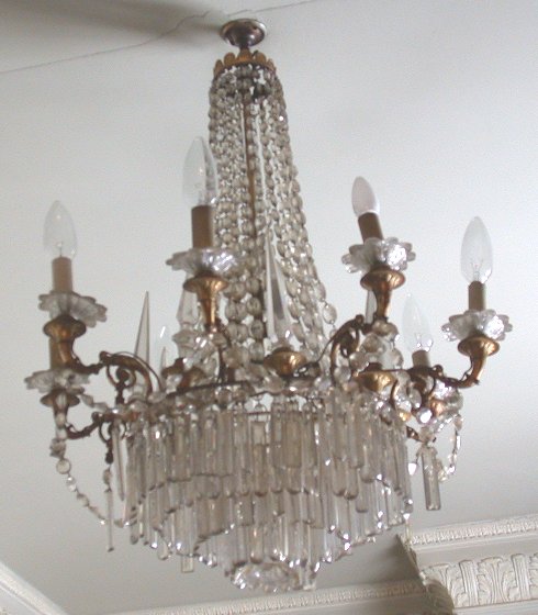 A four tier chased gilt bronze and cut glass chandelier