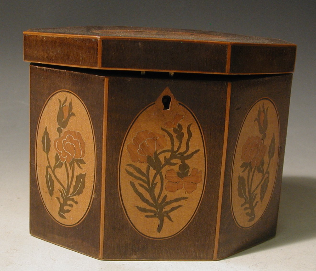 A Georgian mahogany octagonal tea caddy,