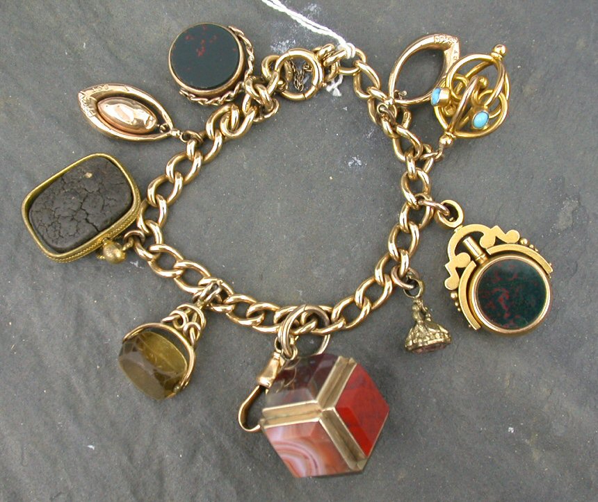 An 18ct gold curb link charm bracelet,