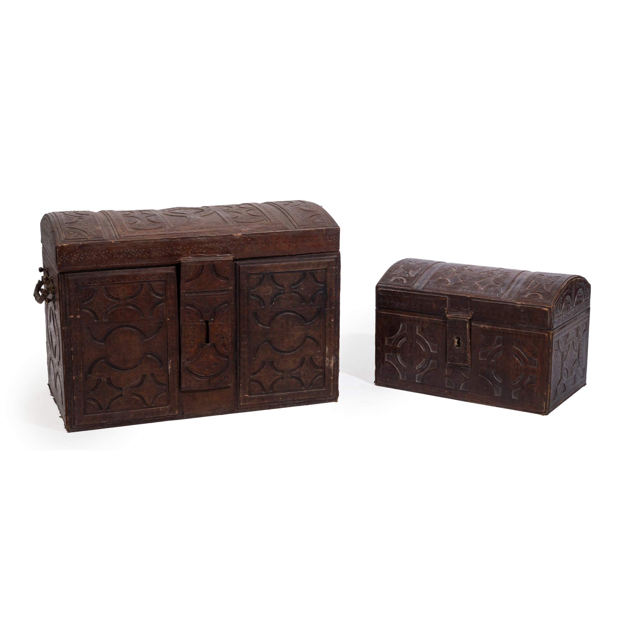 A GRADUATED PAIR OF NORTH AFRICAN TOOLED LEATHER CASKETS