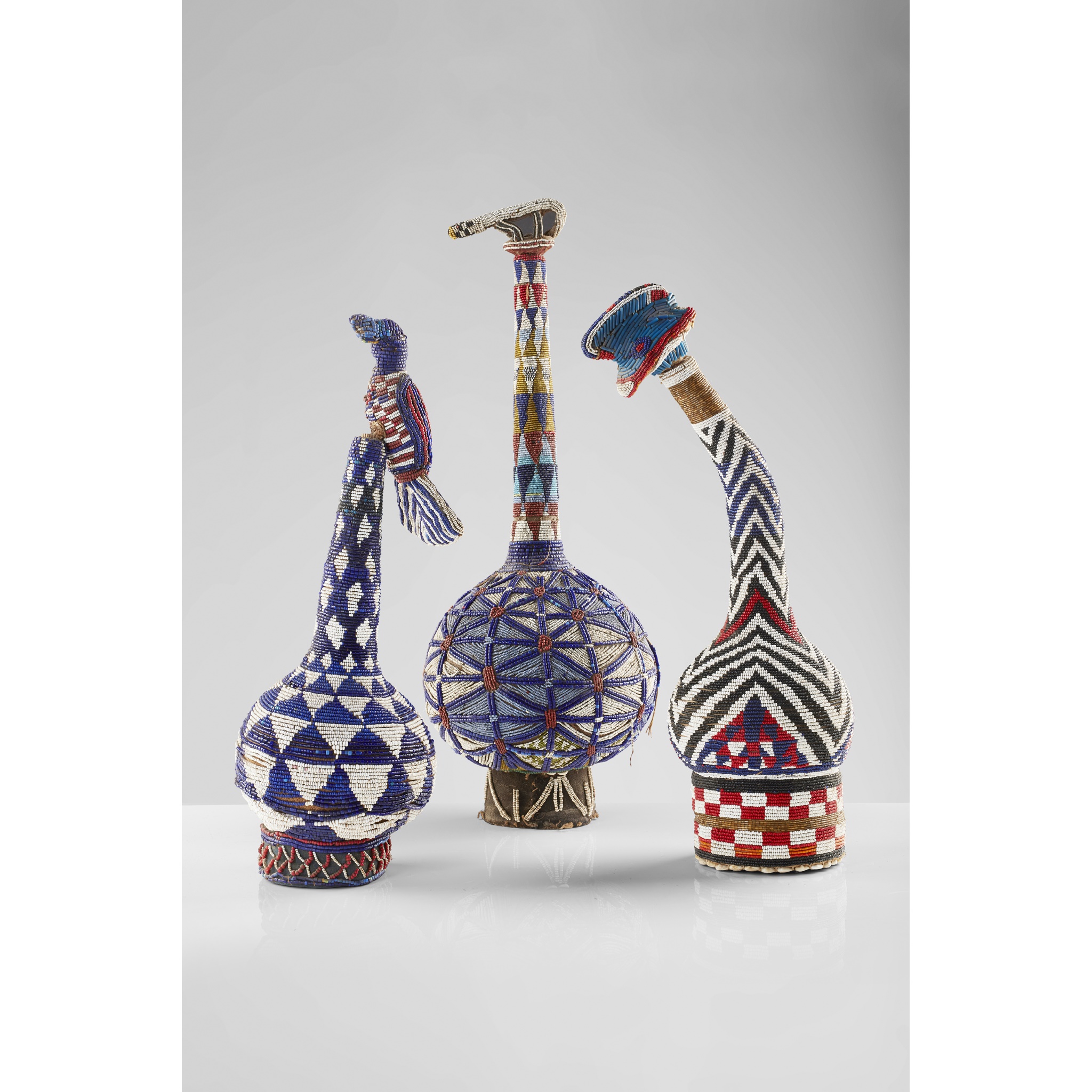 THREE BAMILEKE BEADED GOURDS AND A WALKING STICK