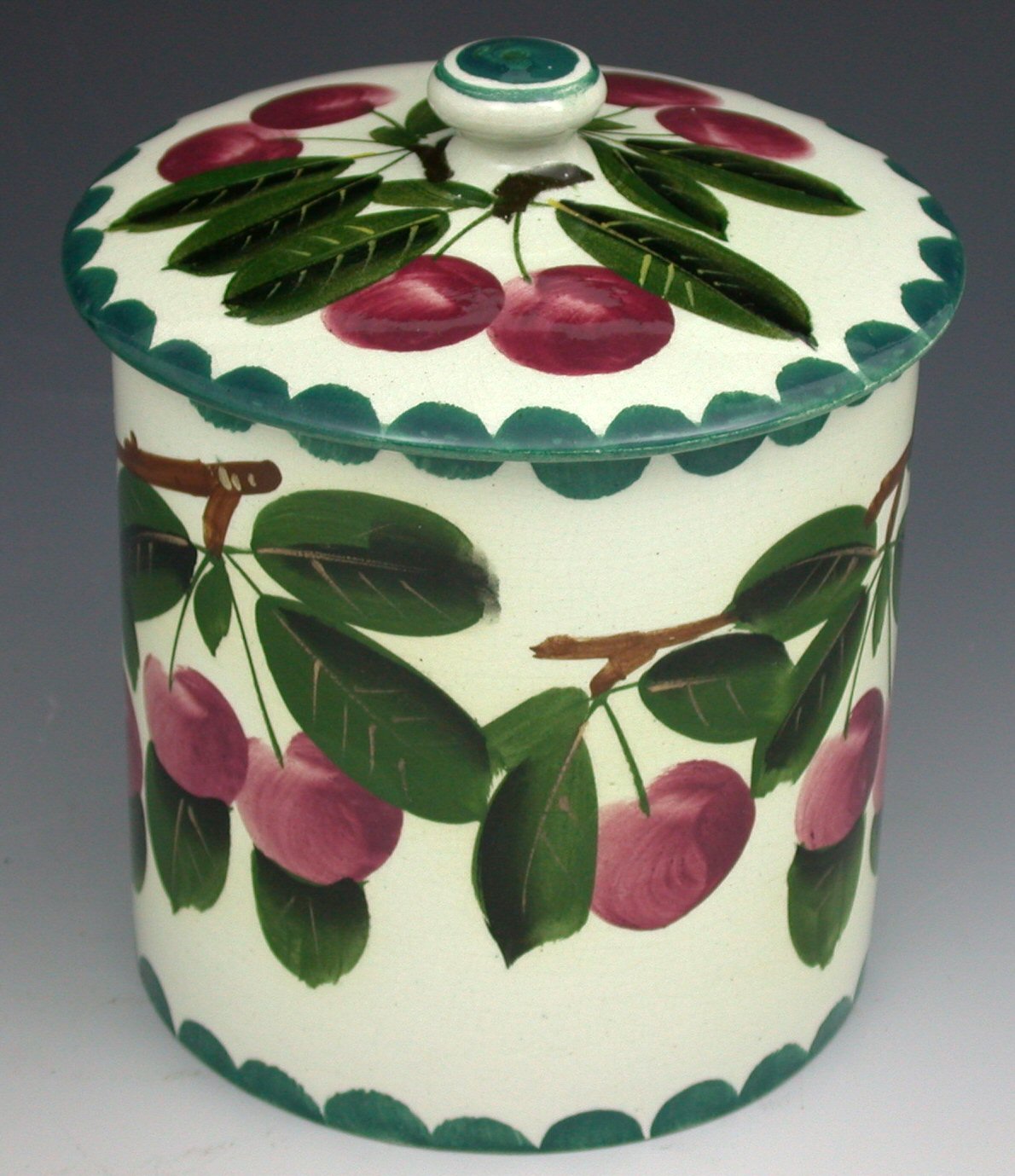 A Wemyss preserve jar and cover,