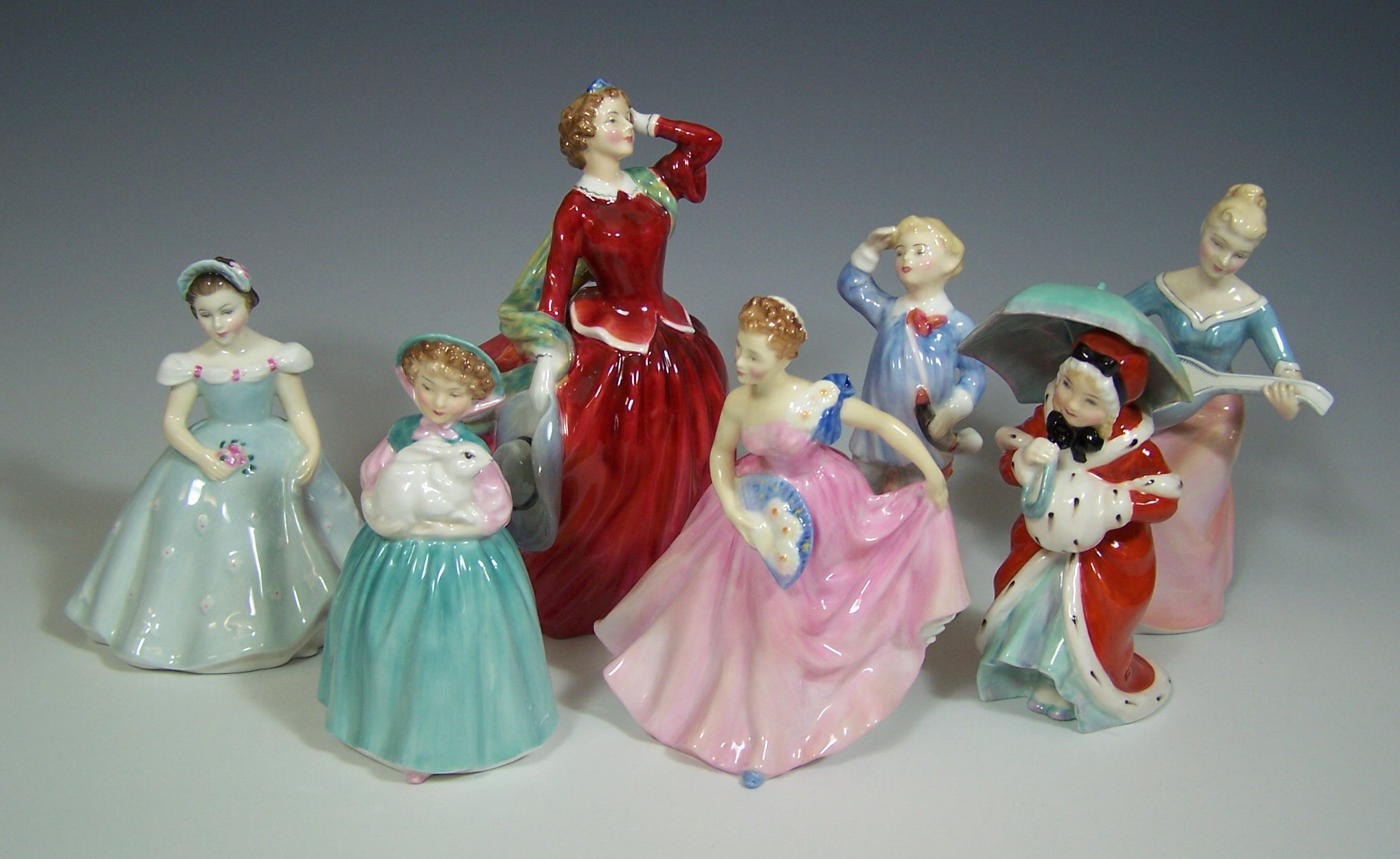 A collection of Royal Doulton figurines,