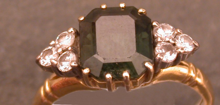 An attractive emerald cut green sapphire,