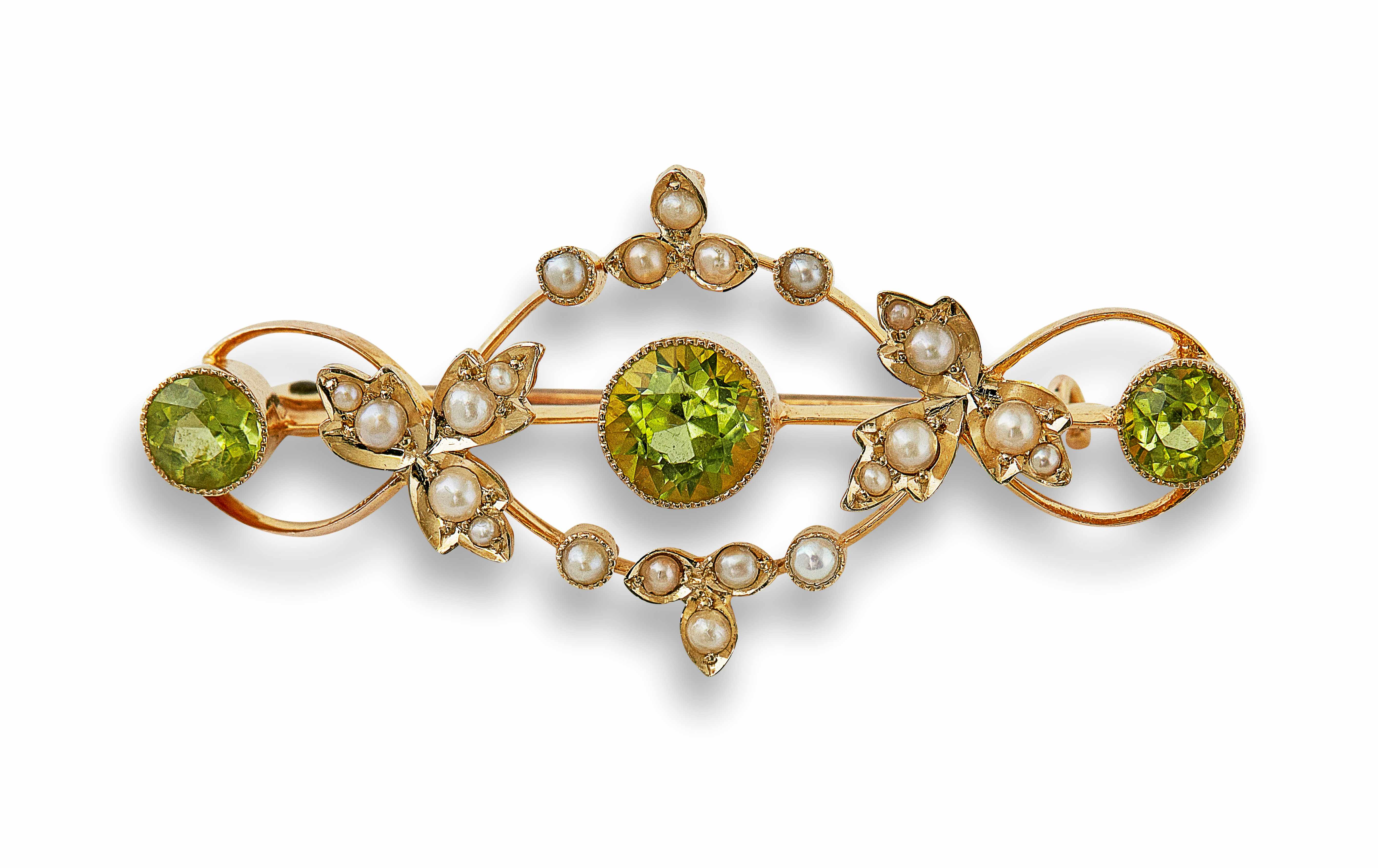 A peridot and pearl set brooch