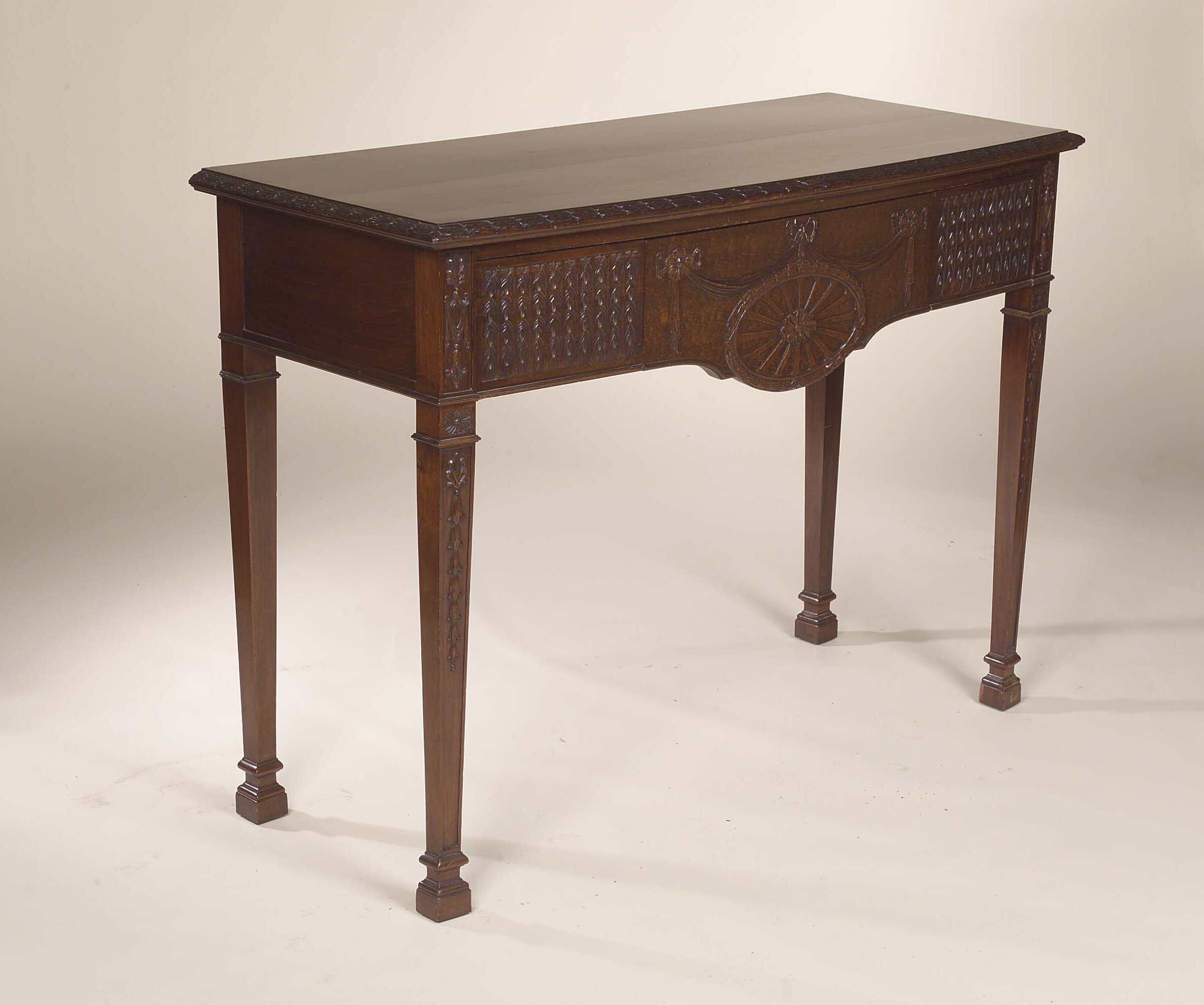 An early 20th century mahogany bowfront serving table,