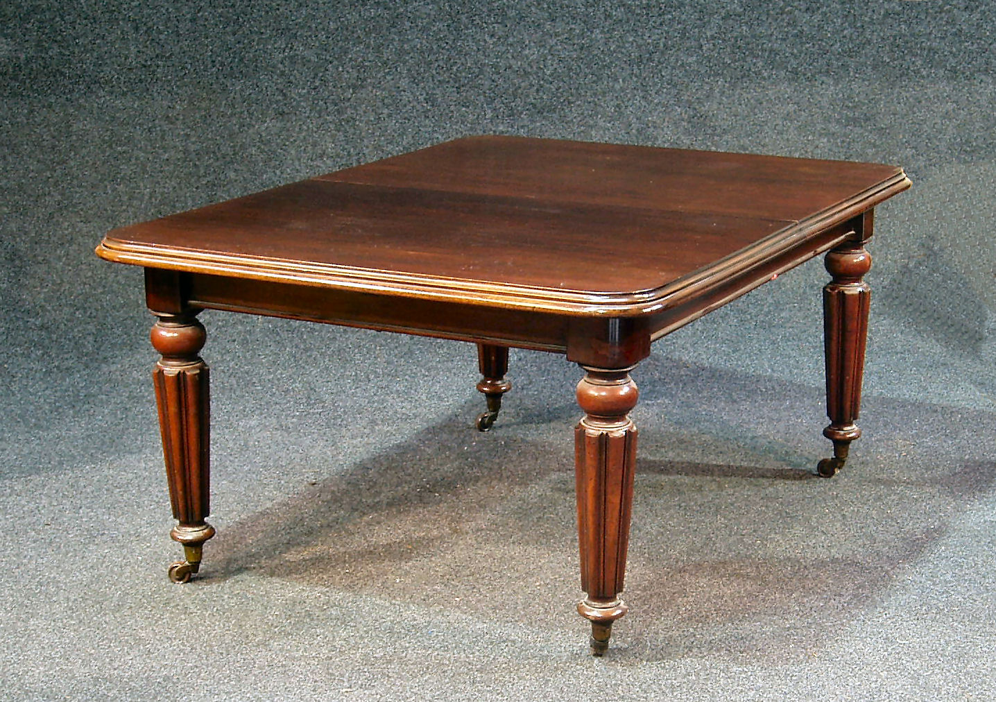 A Victorian mahogany extending dining table,