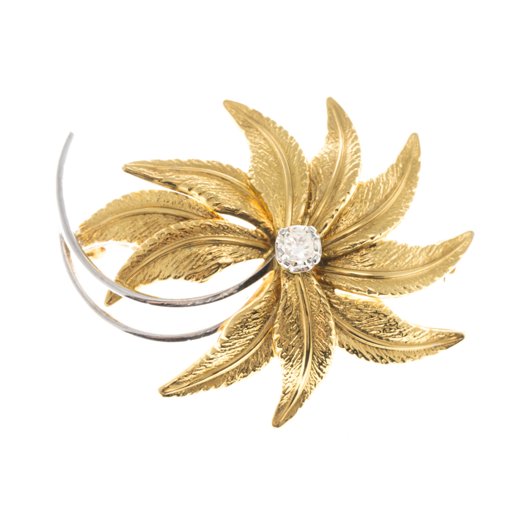 An 18ct gold diamond set brooch