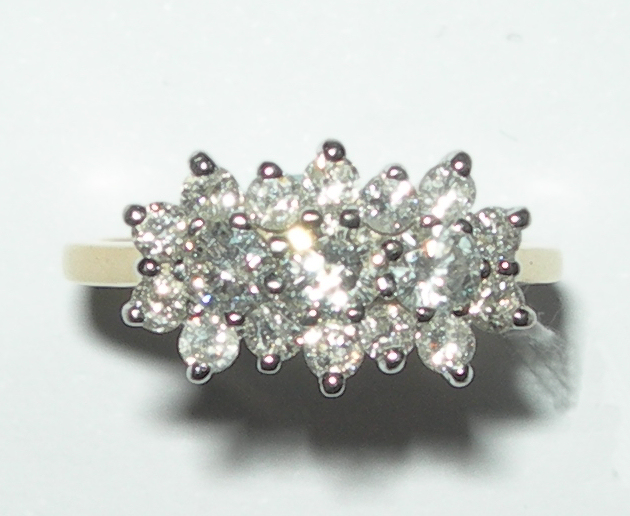 An 18ct gold mounted diamond cluster ring,