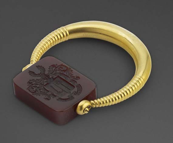A Fabergé gold and cornelian revolving seal