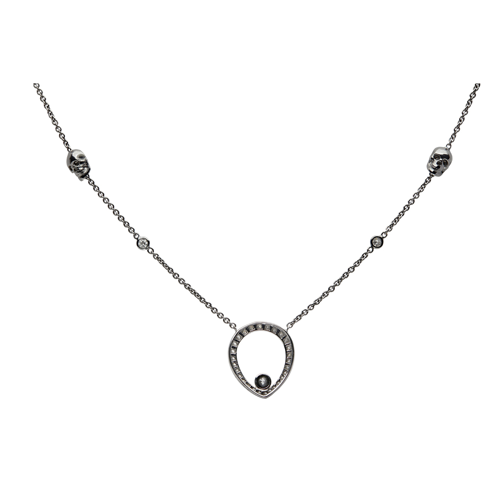THEO FENNELL- A black and colourless diamond set skull necklace